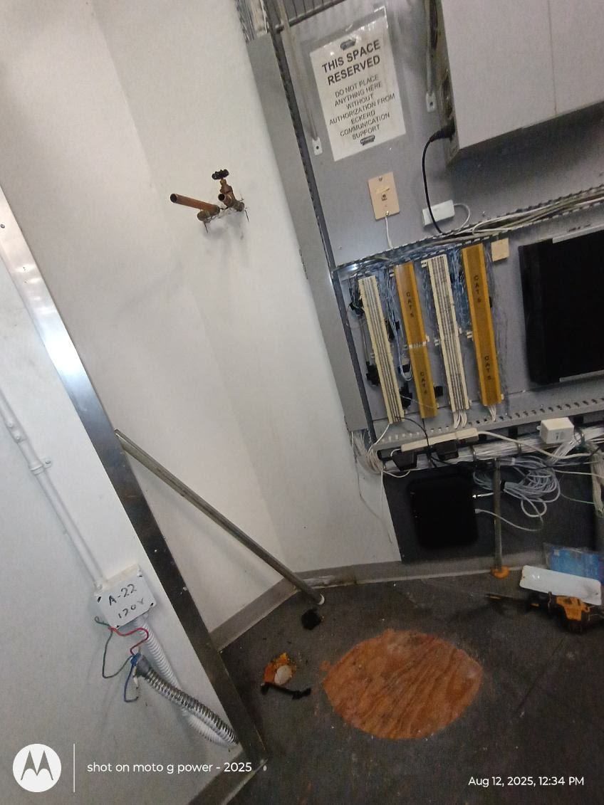 Plumbing and infrastructure repair project in a utility room